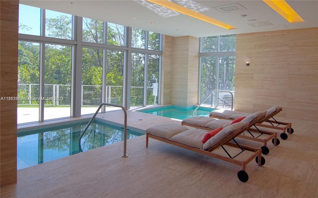 view of swimming pool featuring an indoor in ground hot tub