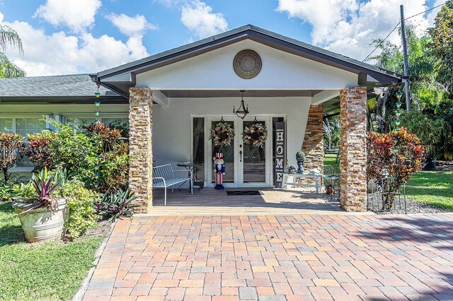 property entrance featuring french doors