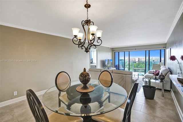 dining room with crown molding, light tile floors, and an inviting chandelier