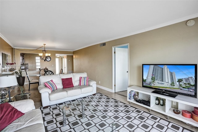 living room with a notable chandelier and ornamental molding