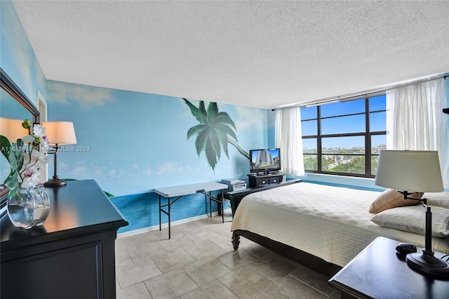 tiled bedroom with a textured ceiling