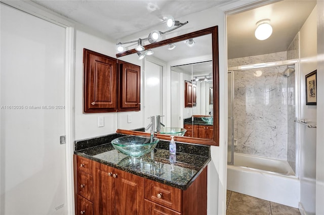 bathroom featuring shower / bath combination with glass door, vanity, and tile floors