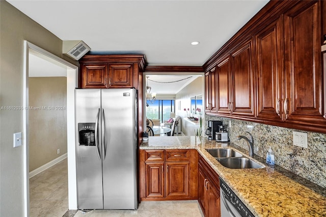 kitchen featuring sink, light tile floors, stainless steel refrigerator with ice dispenser, and backsplash