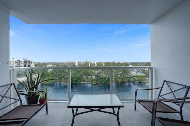 balcony featuring a water view