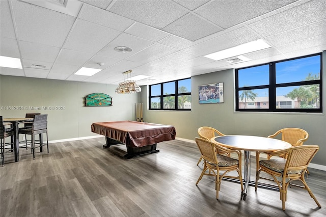 rec room with a paneled ceiling, pool table, and dark hardwood / wood-style floors