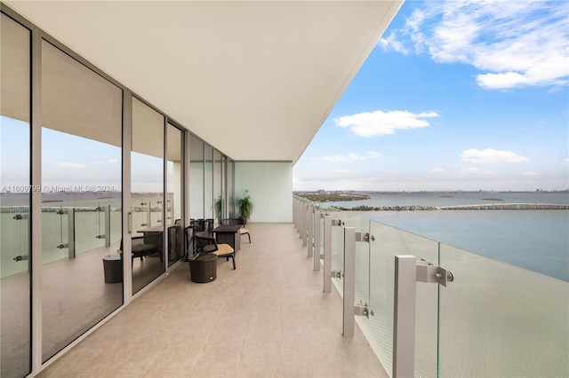 balcony featuring a water view