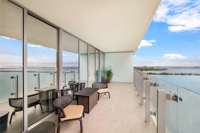 balcony featuring a water view