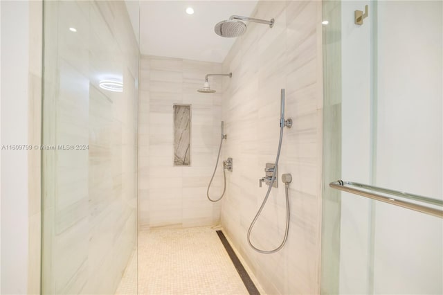 bathroom featuring a shower with door