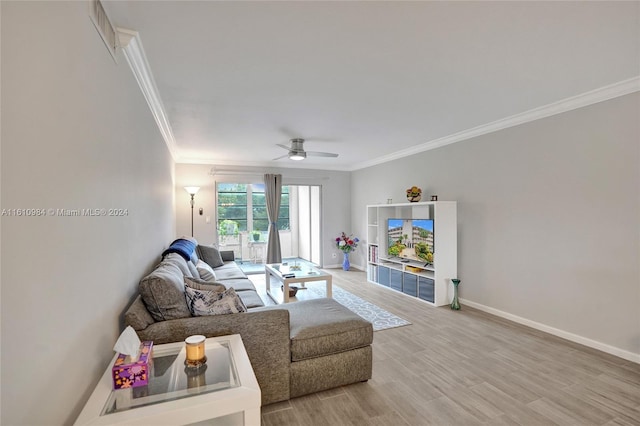 living room featuring ceiling fan, hardwood / wood-style flooring, and ornamental molding