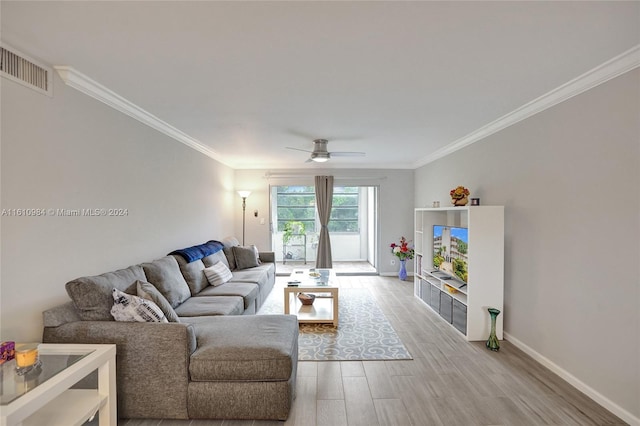 living room featuring crown molding, ceiling fan, and hardwood / wood-style floors