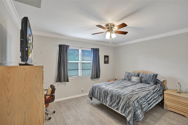 bedroom featuring ornamental molding, wood-type flooring, and ceiling fan