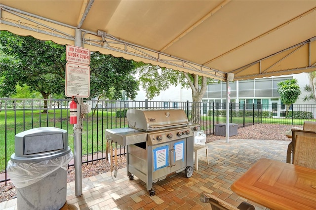 view of patio featuring a grill