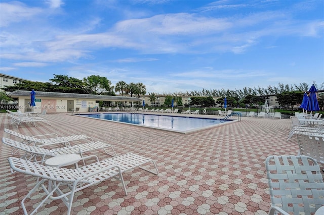 view of swimming pool with a patio area