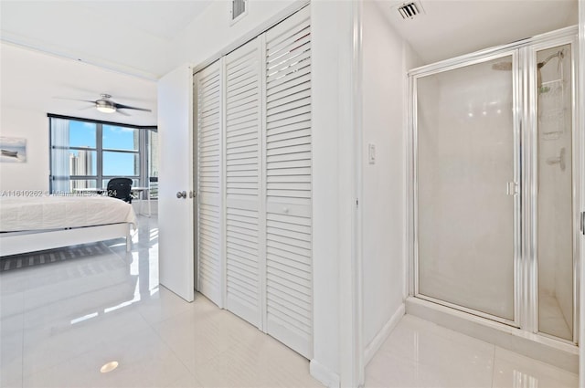 bathroom with tile floors, an enclosed shower, and ceiling fan