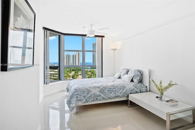 tiled bedroom with ceiling fan