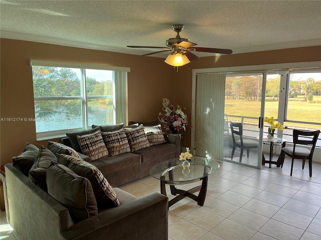 tiled living room featuring a textured ceiling and ceiling fan