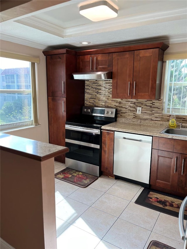 kitchen with backsplash, stainless steel appliances, ornamental molding, and sink