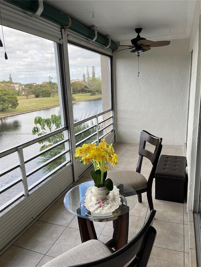 balcony featuring a water view