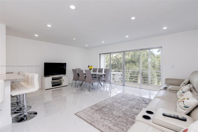 living room featuring light tile floors