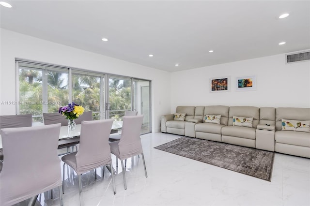 living room featuring light tile floors