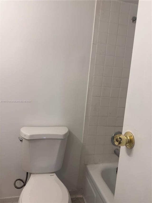 bathroom with toilet and plus walk in shower