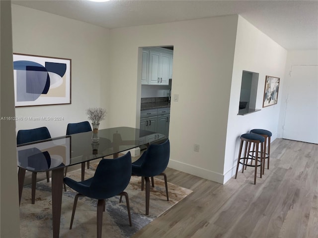 dining room with light wood-type flooring