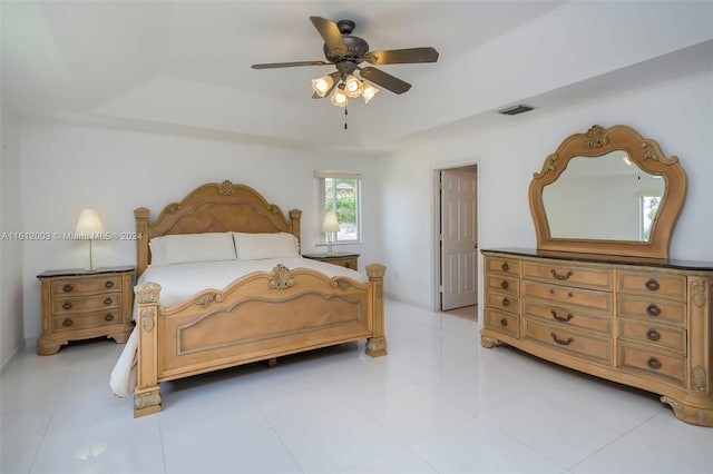 tiled bedroom with ceiling fan