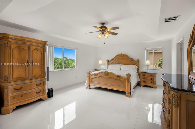 tiled bedroom with ceiling fan