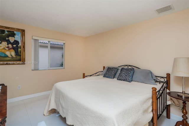 bedroom with light tile patterned flooring