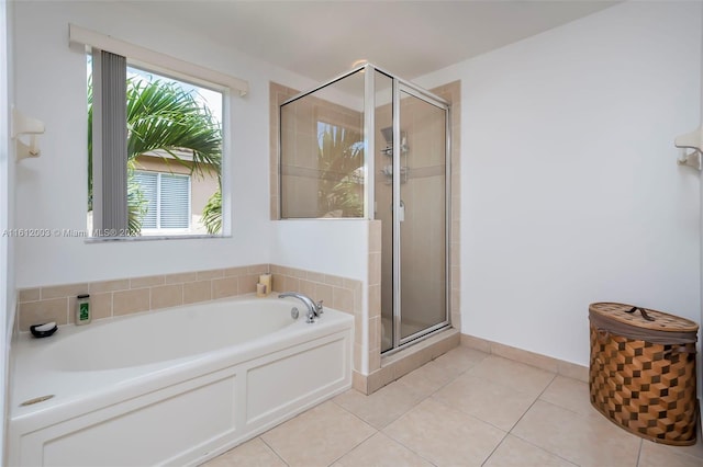 bathroom featuring shower with separate bathtub and tile patterned floors