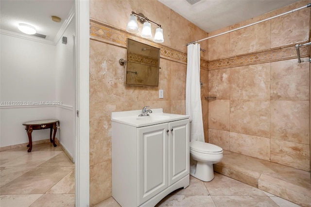 bathroom with tile walls, ornamental molding, a shower with curtain, vanity, and toilet