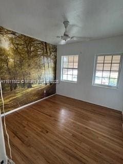 260 NW 119th St, Miami, FL 33168 - spare room featuring wood finished floors and a ceiling fan