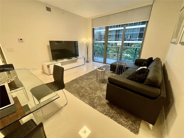 living room featuring a wall of windows