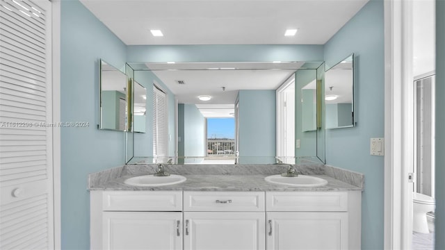 bathroom with vanity and toilet