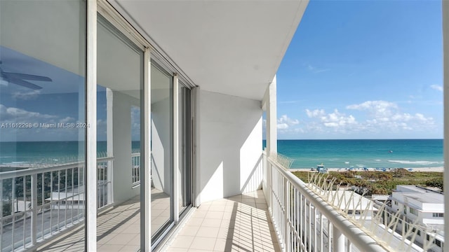 balcony with a view of the beach and a water view