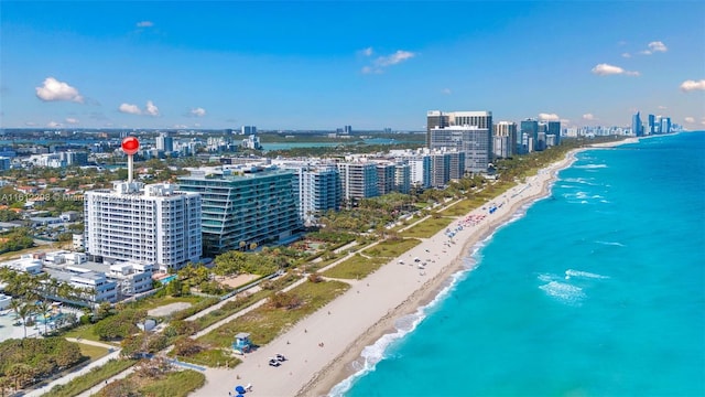 bird's eye view with a view of the beach, a city view, and a water view