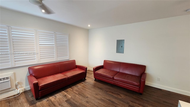 living room with electric panel, dark hardwood / wood-style flooring, and ceiling fan