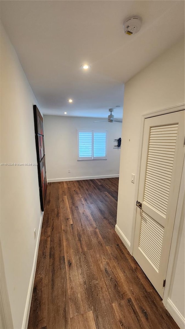 hall with dark wood-type flooring