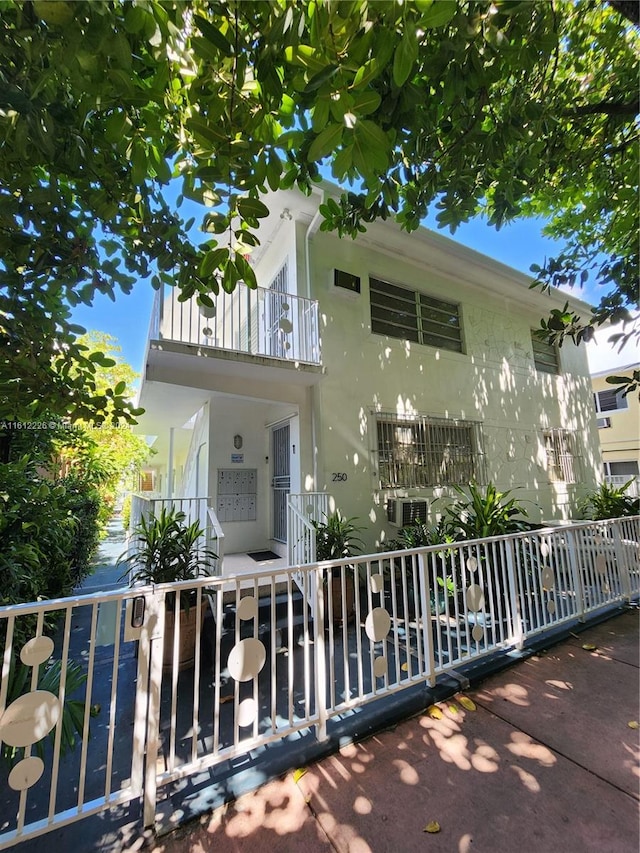 view of front of property with a balcony