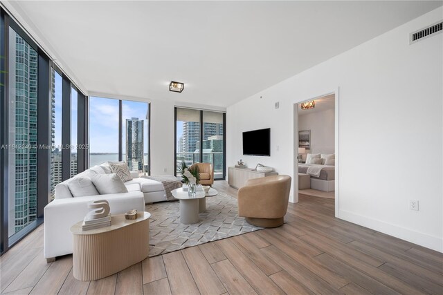 1010 Brickell Ave Unit 2201, Miami, FL 33131 - living room featuring light wood-type flooring