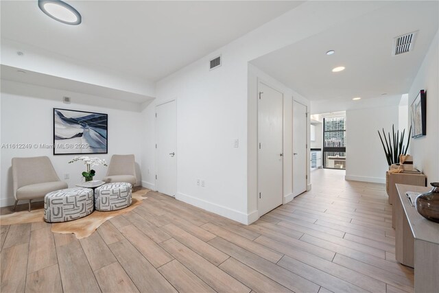 1010 Brickell Ave Unit 2201, Miami, FL 33131 - living area featuring light wood-type flooring, baseboards, and recessed lighting