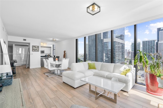 living room featuring light hardwood / wood-style flooring and expansive windows