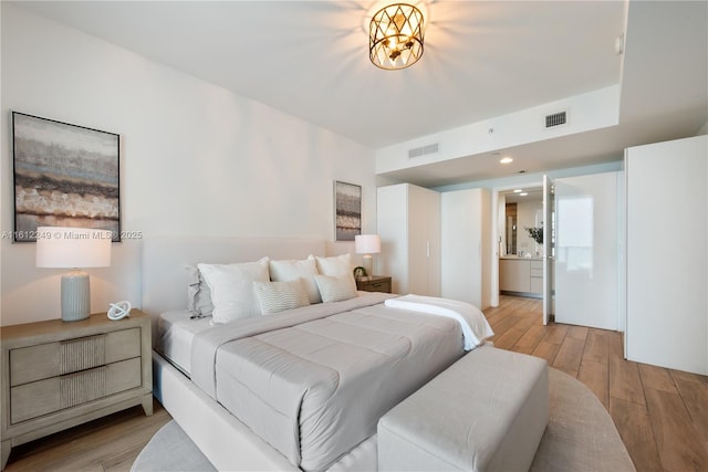 1010 Brickell Ave Unit 2201, Miami, FL 33131 - bedroom featuring light wood finished floors and ensuite bathroom