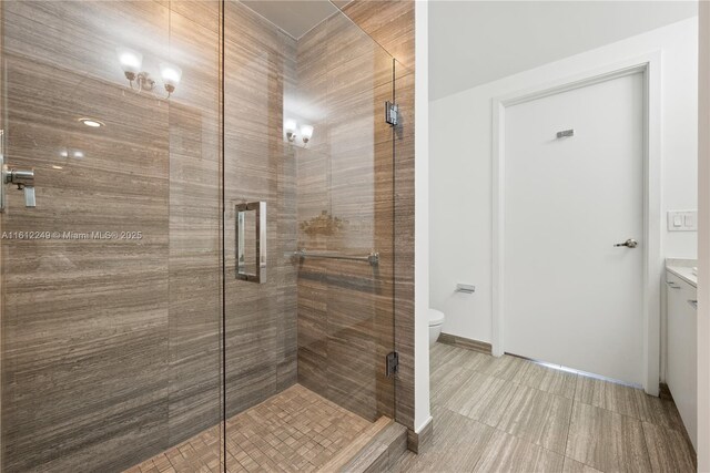 1010 Brickell Ave Unit 2201, Miami, FL 33131 - full bathroom featuring a shower stall, toilet, and baseboards