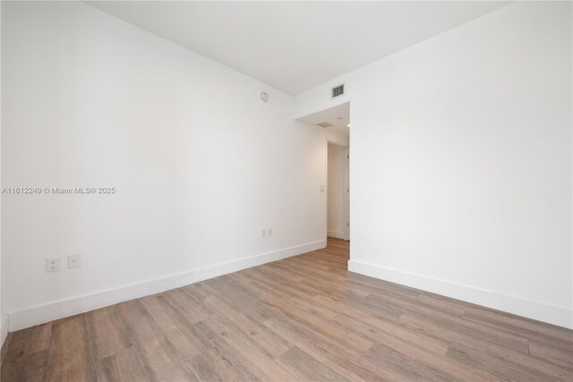 1010 Brickell Ave Unit 2201, Miami, FL 33131 - empty room with wood finished floors and baseboards