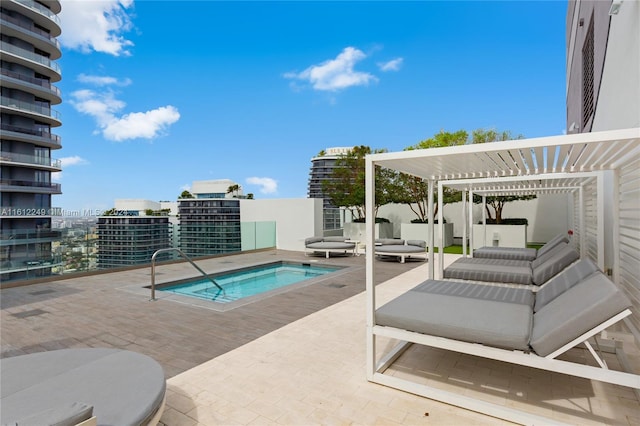 view of swimming pool with a pergola and a patio area