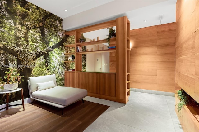 living area with wood walls