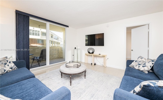 living room with tile flooring and a textured ceiling