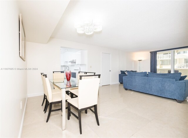 tiled dining room with sink