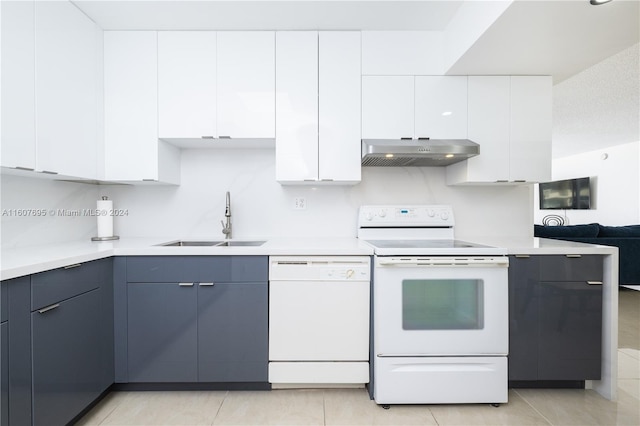 kitchen with white cabinets, sink, white appliances, and light tile flooring